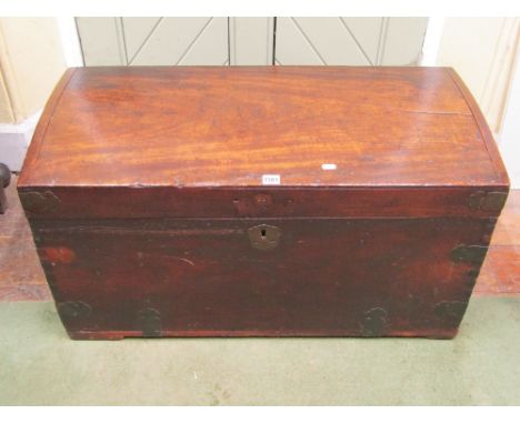 A Georgian camphor wood travelling trunk with lightly domed lid and shaped brass banded supports and escutcheon, 92cm wide