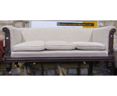 A William IV three seat sofa with rolled arms, low back, oatmeal ground textured upholstery, loose seat cushions and showwood