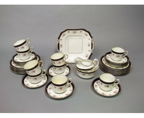 A collection of early 20th century Aynsley tea wares with floral sprig detail comprising milk jug, sugar bowl, cake plate, ni