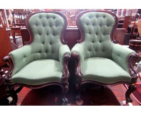 A pair of Victorian spoonback drawing room chairs with green ground and triform patterned upholstered seats, button back and 