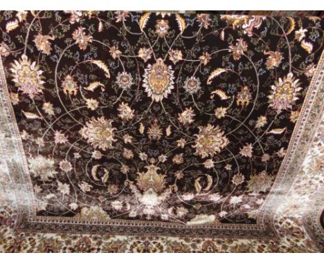 A good quality woven Iranian carpet with sharbas design, scrolled coloured foliage upon a brown ground, 310 x 200 cm