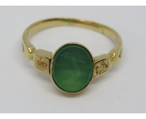 A green stone intaglio swivel ring with crest detail depicting an arm clutching an axe, inscribed to reverse 'non romemmi', i