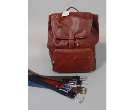 A fossil back pack, as new with tags, in brown leather, height 40cm, together with a collection of men's belts