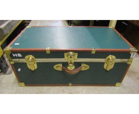 A vintage style trunk with applied overlaid fittings with raised lettering Concourse to simulated leather strap/handle
