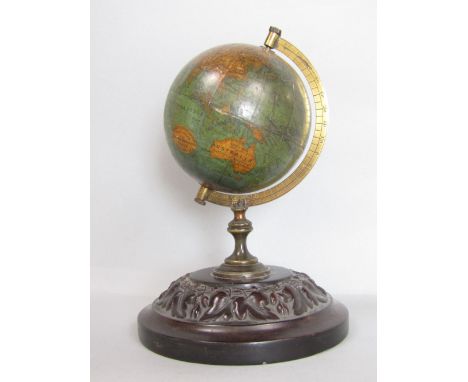 Interesting miniature terrestrial globe upon a bakelite stepped circular base, cast with foliage, 17cm high