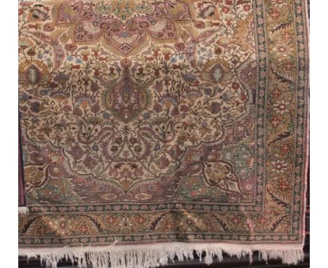 Good Persian flat weave carpet, centrally decorated with a floral medallion, framed by further scrolled foliate upon a cream 