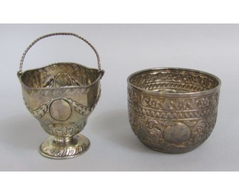 Victorian silver basket, with hinged handle and embossed garland detail, maker JP BP, London 1892; together with a further Vi