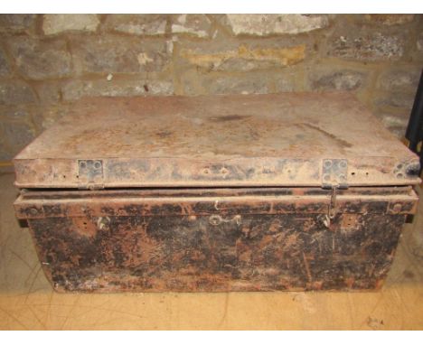 An old tin trunk with contents to include vintage carpentry tools to include block and other planes, clockwork spit jack moto