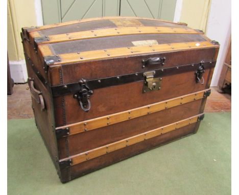 A good late 19th century travelling trunk with original canvas finish within a timber and steel lathe framework, partially fi