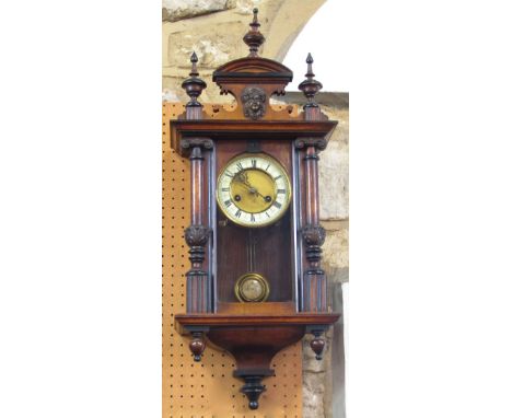 Continental drop dial wall clock with twin train movement and enamel chapter ring within an architectural case, 70cm high, ke
