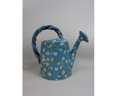 A late 19th century French Longwy vase in the form of a watering can with turquoise glaze and moulded floral detail and twist