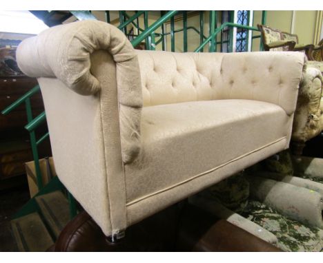 A contemporary Chesterfield sofa, with button back and scrolled arms on turned supports, 160cm wide