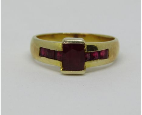 A channel set ruby ring marked 585, size S, 5.1g
