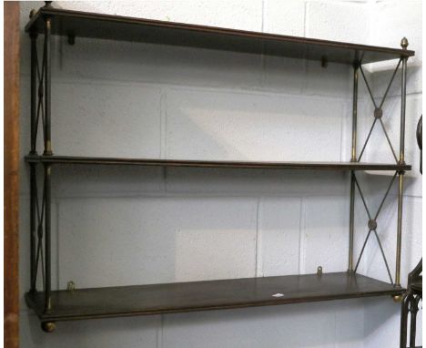 A Mahogany Three Tier Hanging Shelf, 19th century, with brass column supports, having acorn finials and x-form side struts, 7