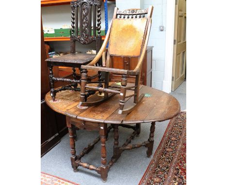 An 18th Century Oak Gate Leg Table, A Victorian Carved Oak Hall Chair and A Rocking Chair (3)