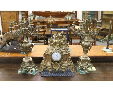 A Gilt Metal Imperial Striking Mantel Clock, 20th century, with later candelabra garniture, 42cm high, garniture 61cm high