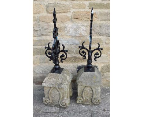 A Pair of Carved Sandstone and Black Painted Wrought Metal Gate Post Finials, 94cm high