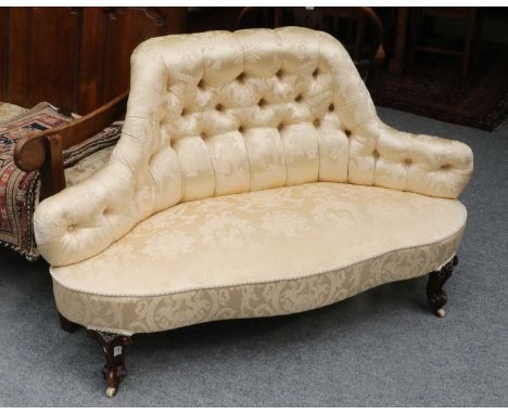A Victorian Carved Mahogany Framed Boudoir Sofa, with button back upholstery, 130cm