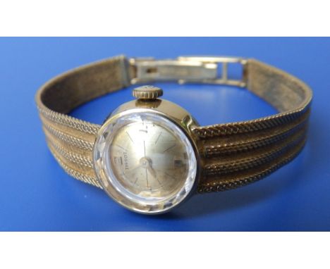 A lady's 18ct gold Tissot bracelet wrist watch