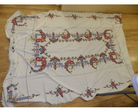 A table cloth embroidered in tapestry style