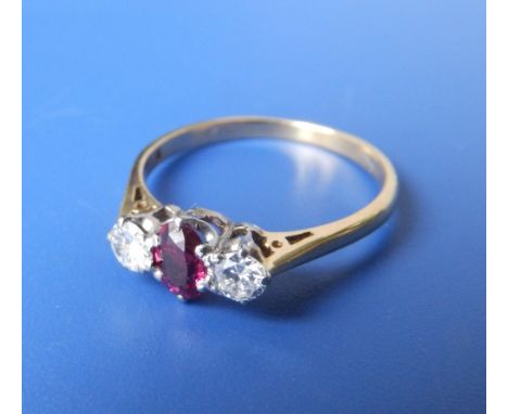 A three stone ruby & diamond ring