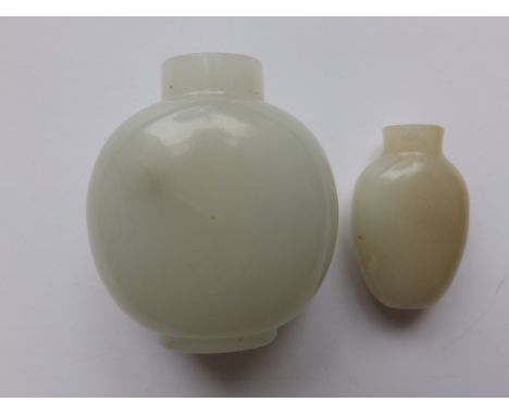 A plain jade Chinese snuff bottle and one other smaller (2)