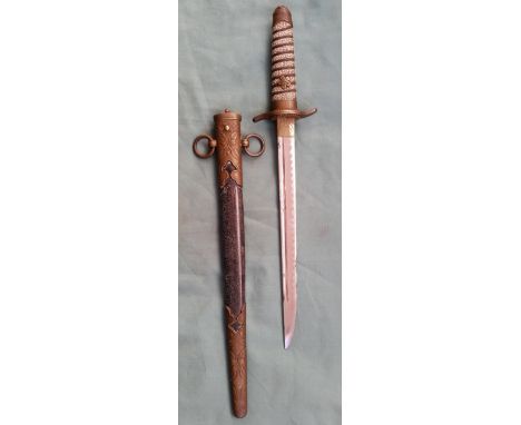 A Japanese WWII brass mounted naval dirk in scabbard