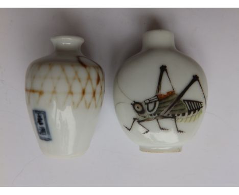 A Chinese porcelain snuff bottle, painted to each side with a cricket, red seal mark to underside , 2.25”, together with a sm