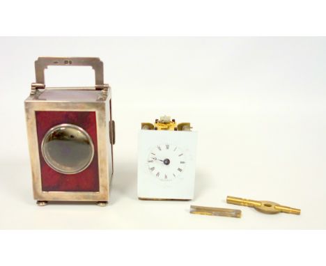 A late Victorian silver mounted crimson red ?sunburst? glass miniature timepiece, the rectangular case with a convex glass ap