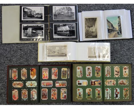 Album with 2 postcards and postcards and photos of London and other buses, other postcards, another album including transport