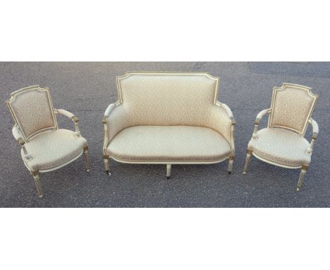 Louis XVI style cream and gilt salon sofa with padded curved scroll arms, upholstered in all-over rose gold floral fabric, 87