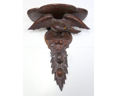 Black Forest carved wood wall bracket with an eagle and fruit, H 60.5cm 