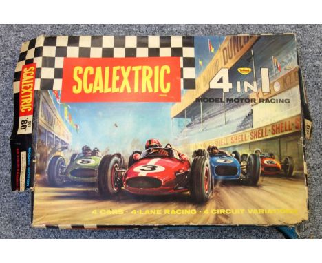 A vintage Set 80 Scalextric with track, four cars, track side accessories pack, power triggers and transmitter, boxed 