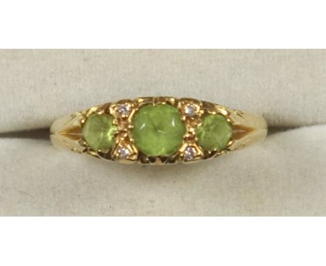 18ct gold ring set 3 pale green stones, by L&amp;W, Birmingham 1991 and an 18ct cufflink, gross 8.8grs (2) 
