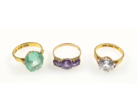 Chinese yellow metal ring set cubic zirconia, yellow metal ring set green stone and a yellow metal ring set 3 purple stones, 