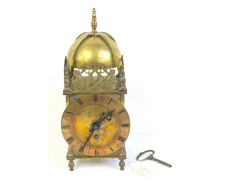 17th century style brass lantern clock, the domed bell over a dial with single wind hole to a Swiss movement on peg feet, (wi