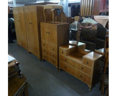 CIRCA 1940's WALNUTWOOD BEDROOM SUITE OF 6 PIECES, INCLUDING; TWO WARDROBES, A SUNK CENTRE DRESSING TABLE, A TALLBOY, A STOOL