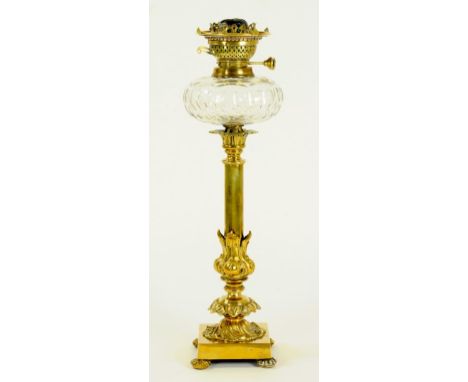 A VICTORIAN BRASS OIL LAMP WITH CUT GLASS FOUNT, YOUNG'S BURNER AND LEAFY ENVELOPED PILLAR, ON SQUARE BASE 