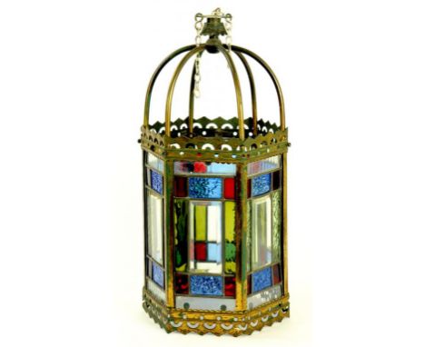 A LATE VICTORIAN LACQUERED BRASS HEXAGONAL HALL LANTERN WITH CLEAR AND COLOURED, LEADED GLASS LIGHTS 