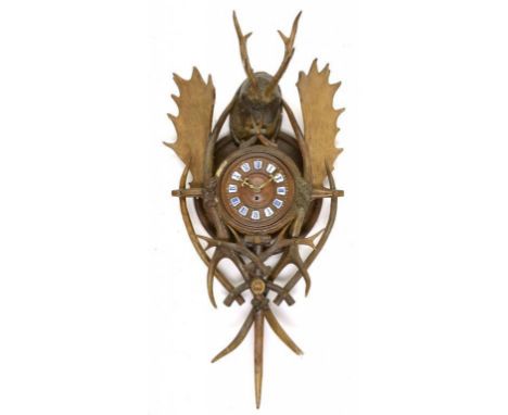 A GERMAN ANTLER, WOOD AND COMPOSITION WALL CLOCK, LATE 19TH C the brass timepiece in rectangular tinplate housing, having tur