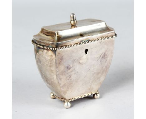 AN EARLY 18TH CENTURY DUTCH SILVER SHAPED TEA CADDY with lid, bead edge on four ball feet. 5ins high.