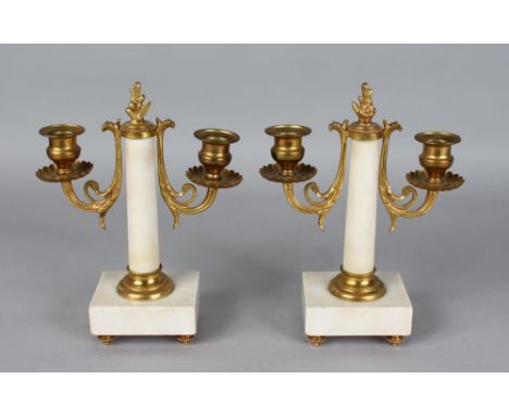 A SMALL PAIR OF FRENCH WHITE MARBLE AND ORMOLU TWO LIGHT CANDLESTICKS on square bases. 8.5ins high.