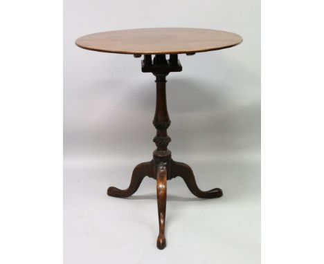 A GEORGE III MAHOGANY CIRCULAR TOP TRIPOD TABLE with bird cage support, turned centre column ending in tripod legs with pad f