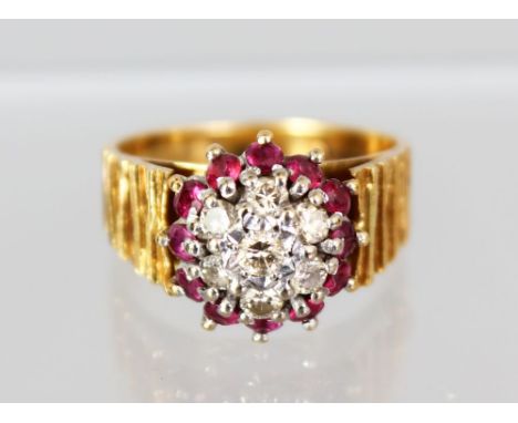 AN 18CT YELLOW GOLD, RUBY AND DIAMOND CLUSTER RING.