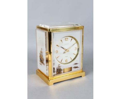 A JAEGER-LECOULTRE MARINA ATMOS CLOCK in a gilt metal case.  9ins high.