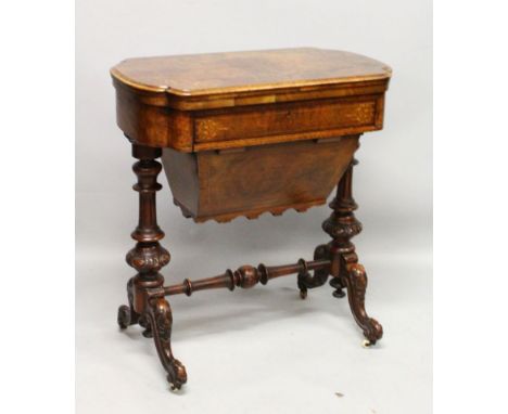 A GOOD VICTORIAN FIGURED WALNUT GAMES AND SEWING TABLE, the folding top with inlaid chess, backgammon and crib, with single d