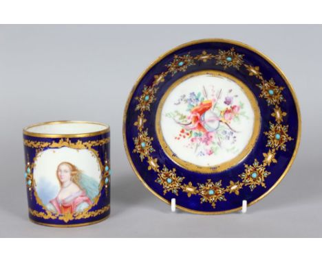 AN 18TH CENTURY SEVRES COFFEE CAN AND SAUCER, with rich blue ground, edged in gilt with turquoise and painted with a portrait