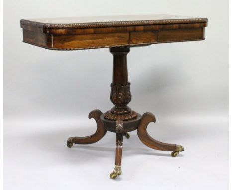 A SUPERB REGENCY "GILLOW" MODEL ROSEWOOD CARD TABLE, the rising top with bead edge and red velvet interior, on a centre carve