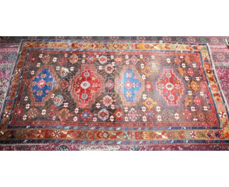 A LARGE PERSIAN CARPET with four major motifs, the border with gulls. 10ft 3ins x 5ft 9ins (some wear).