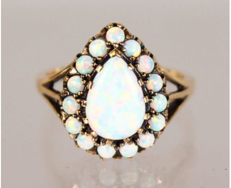 A GOOD 9CT YELLOW GOLD PEAR SHAPED GILSON OPAL RING.